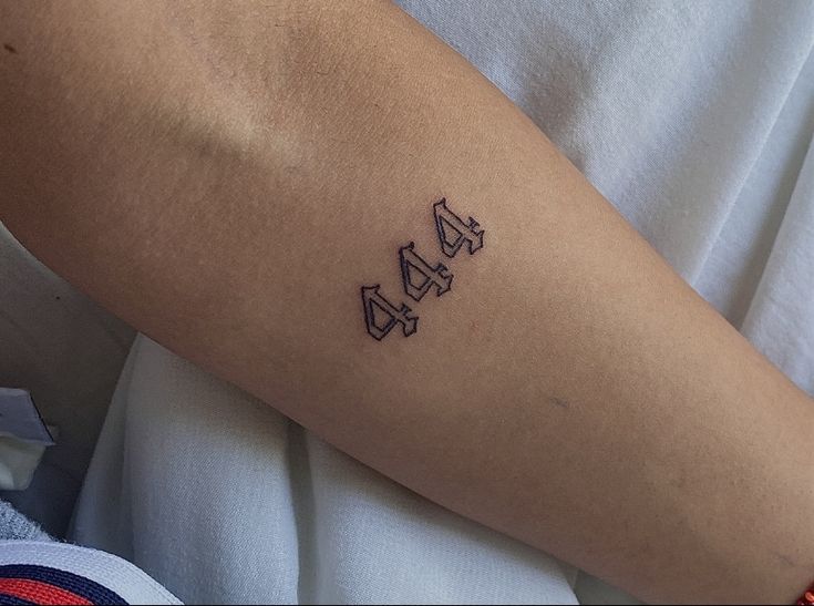 a person with a small tattoo on their arm