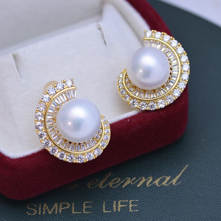 Elevate your elegance with our 11-12mm Freshwater Pearl Ear Studs adorned with sparkling cubic zirconia. The lustrous pearls, ranging from 11-12mm, exude timeless sophistication, while the cubic zirconia adds a touch of glamour. These exquisite ear studs effortlessly blend classic and contemporary, making them a radiant and versatile accessory. Material: Freshwater Pearl with 925 sterling silver Product Information Pearl Type Freshwater Pearl Origin China Shape Round Quality AAAA Size 11-12mm Na Pearl White Cubic Zirconia Pearl Earrings For Evening, Exquisite Pearl Earrings With Cubic Zirconia For Evening, Exquisite Evening Pearl Earrings With Cubic Zirconia, Exquisite Cubic Zirconia Pearl Earrings For Evening, Evening Pearl Earrings In Diamond White With Cubic Zirconia, Diamond White Cubic Zirconia Pearl Earrings For Evening, Luxury Pearl Earrings With Cubic Zirconia For Evening, Pearl White Cubic Zirconia Bridal Earrings, Luxury Cubic Zirconia Pearl Earrings For Formal Occasions