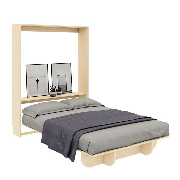 a bed with two mirrors on the wall above it