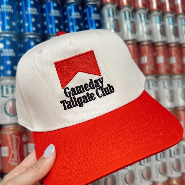 This Gameday Tailgate Trucker Hat is perfect for game days. It features "Gameday Tailgate Club" text on the front, for a stylish finish. This structured, mid-profile hat is the perfect way to show off your team spirit. Adjustable back Embroidered black "Gameday Tailgate Club" text Beige color with red bill Funny Tailgate Shirts, Game Day Flat Brim Snapback Hat For Baseball Season, Baseball Cap For Tailgating During Baseball Season, Team-colored Snapback Baseball Cap For Game Day, Team-colored Snapback Hat For Game Day, Game Day Sports Fan Snapback Hat, Team-colored Snapback Visor Hat For Game Day, Team-colored Snapback Visor For Game Day, Snapback Hat For Game Day Sports Fans