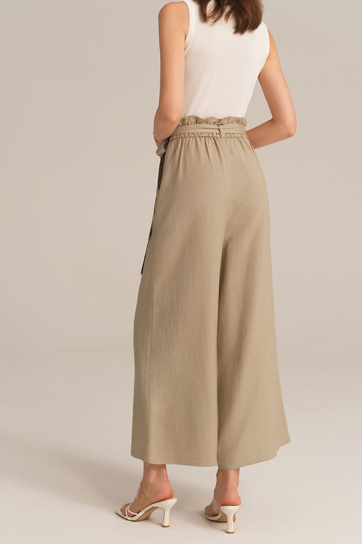 Experience the perfect blend of comfort and style with this casual elastic waist wide leg pants. This pants are designed for versatility and effortless elegance, making them a must-have for any casual occasion. Embrace a relaxed and chic look that is both comfortable and fashion-forward.Material : 75%Viscose+25%LinenElasticity : NoneSku : CL2814S24*Package : 1*PantsCare instructions:Do Not Bleach.Separate dark colors.Iron Low Heat. Chic Spring Wide Leg Pants Solid Color, Chic Solid Color Culottes With Loosely Fitted Hips, Casual Wide-leg Summer Capris, Casual Wide Leg Pants With Tie Waist, Summer Casual Wide-leg Capris, Spring Wide Leg Culottes With Elastic Waistband, Spring Solid Wide Leg Pants With Tie Waist, Versatile Wide-leg Pants With Tie Waist, Spring Solid Color Ankle-length Harem Pants