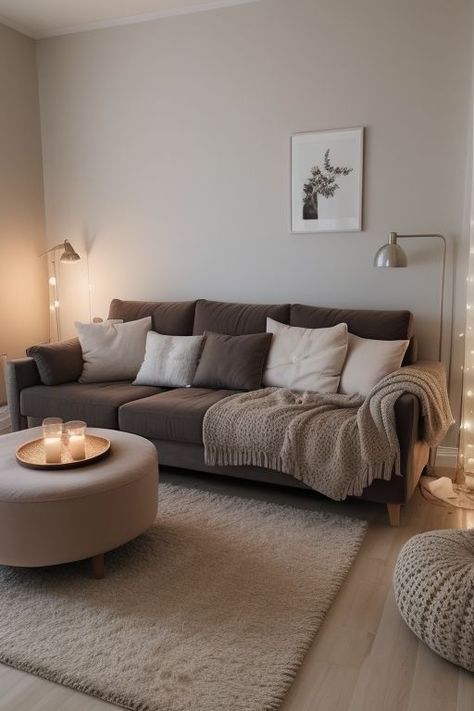 a living room filled with lots of furniture and candles on the coffee table in front of it