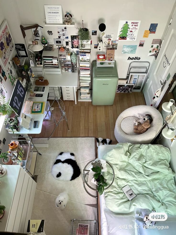 an aerial view of a bedroom with a bed, desk and chair in the corner