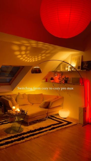 a living room filled with furniture and red lights