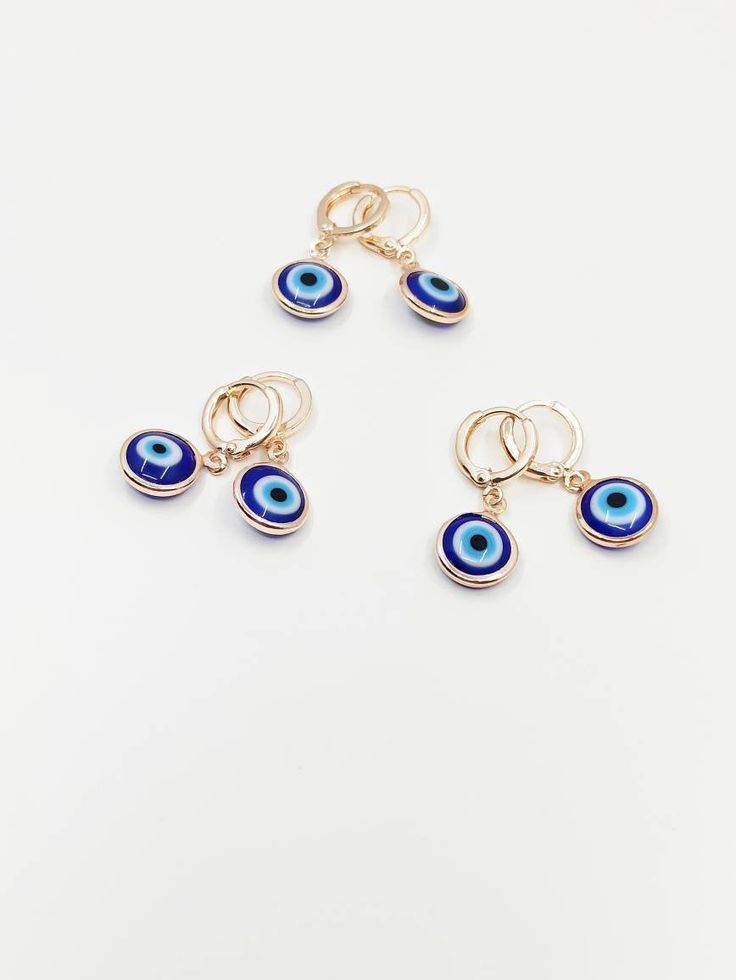 Huggie earrings with evil eye charms are perfect gift choice on Christmas or Birthday. Evil eye jewelry is tarnish resistant, cannot be faded in along time. Evil eye hoop earrings are great for daily wear. Lenght of the evil eye earring is 3 cm.(1 in) Lenght of the evil eye drop is 1 cm.(0.5 in) For more evil eye, nazar earrings, click the link below; https://www.etsy.com/shop/EyeDesignsbyGG?ref=search_shop_redirect&section_id=30204796 Evil Eye Hoop Earrings Gift, Evil Eye Hoop Earrings As A Gift, Evil Eye Round Earrings For Gift, Dangle Hoop Earrings With Evil Eye For Gifts, Evil Eye Dangle Hoop Earrings As Gift, Dangle Hoop Earrings With Evil Eye As Gift, Turkish Accessories, Eye Drop, Eye Gift