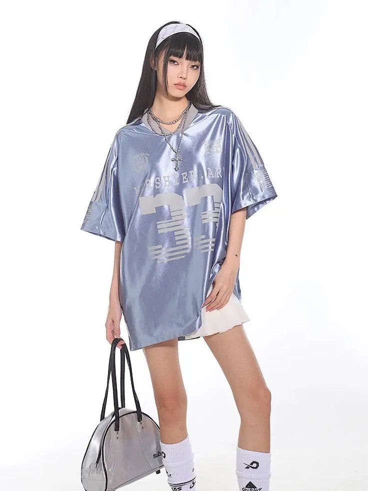 𝔇𝔢𝔱𝔞𝔦𝔩𝔰: Style: Y2k, Street fashion, Grunge Material: Cotton & Polyester This sporty fashion piece is perfect for a casual day out, offering a relaxed yet stylish look. Made with lightweight silky fabric, the soft blue shade adds a touch of sophistication to your street style ensemble. Made with premium material, perfect for summer! Free Shipping with over 80 $ purchase! We ship worldwide!! SIZE CHEST LENGTH S 50 in 28 in M 51 in 29 in L 52 in 30 in SIZE CHEST LENGTH S 126 cm 72 cmM 130 c Oversized Hip Hop Tops For Spring, Blue Short Sleeve Top For Leisure, Urban Style Blue Summer Tops, Urban Blue Tops For Summer, Blue Hip Hop Tops For Sports, Oversized Blue Tops For College, Casual Blue T-shirt For Leisure, Blue Drop Shoulder Tops For Spring, Light Blue Athleisure Top For Streetwear