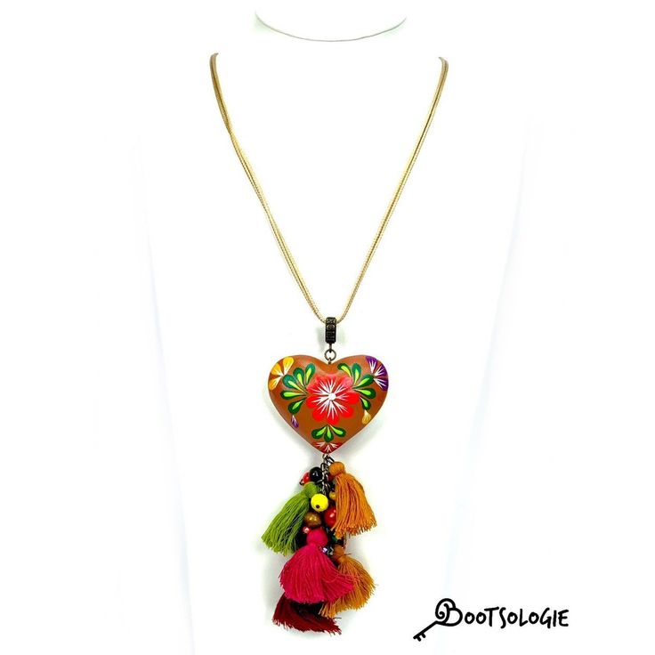 Hand painted heart Necklace. Hand painted by artisans in Chiapas Mexico, this lovely necklaces are decorated with wooden hearts and many bead strands to give the ethnic a more modern look. Adjustable height so you can wear it close to the neck or way below. Dimesions: 22 inches long. Unique Heart-shaped Festival Jewelry, Heart Charm Necklace For Festivals, Adjustable Bohemian Heart Pendant Jewelry, Heart Charm Necklace For Festival, Handmade Spiritual Necklaces As Souvenir, Traditional Multicolor Heart Beads Necklace, Traditional Multicolor Jewelry With Heart Beads, Heart-shaped Necklace With Heart Charm For Festivals, Bohemian Heart Shaped Necklace