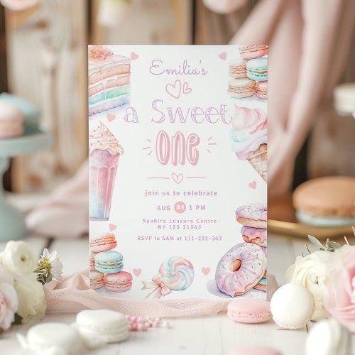 a sweet one birthday party with donuts and macaroons