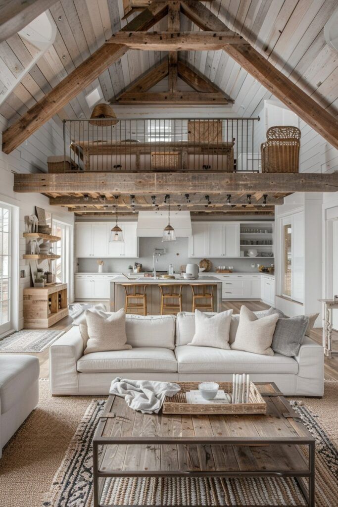 a living room filled with furniture next to a kitchen and an open concept floor plan