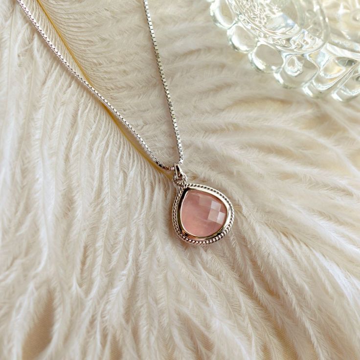 An essential in every gemstone jewelry collection, our Rose Quartz Compassionate Heart Adjustable necklace features the "Stone of Love", perfect for every day wear.  Rose quartz is considered beneficial for not only romantic love, but for helping to enhance unconditional love in friendships, and heal trauma and emotional wounds. Rose quartz is thought to increase compassion for self and others.  This necklace features a rose cut pear shaped rose quartz stone. White rhodium over sterling silver w Rose Gold Sterling Silver Pendant Crystal Necklace, Elegant Teardrop Pendant Crystal Necklace, Elegant Mother's Day Pendant Crystal Necklace, Elegant Silver Crystal Necklace With Gemstone, Elegant Silver Gemstone Crystal Necklace, Elegant Pink Charm Necklaces With Delicate Chain, Elegant Pink Charm Necklace With Delicate Chain, Elegant Silver Crystal Gemstone Necklace, Feminine Rose Gold Jewelry With Gemstone