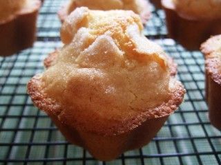 several muffins are cooling on a wire rack