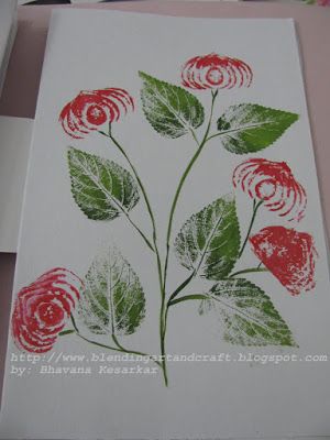 a card with red and green flowers on it