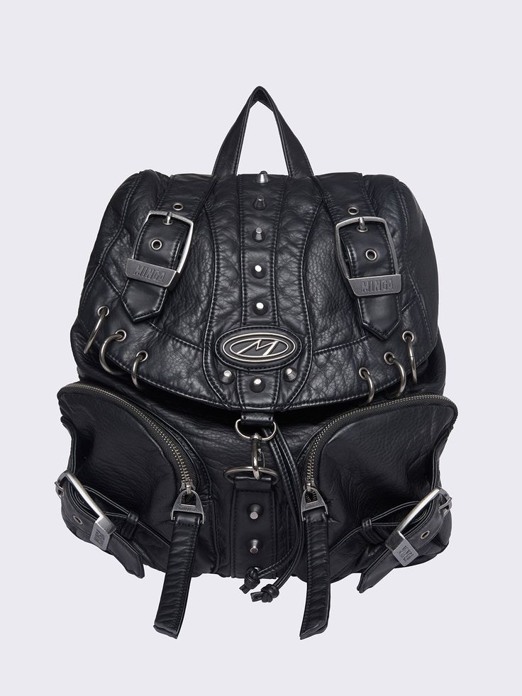 Embrace Y2K grunge with our black faux leather backpack, packed with o-rings, piercings, buckles and zip pockets. This vintage-inspired, multi pocket bag merges retro flair with a bold, edgy look. Shop now at Minga London! Multi Pocket Bag, Minga London, Vegan Leather Backpack, Faux Leather Backpack, Edgy Look, Pocket Bag, Y2k Grunge, Black Faux Leather, Leather Backpack