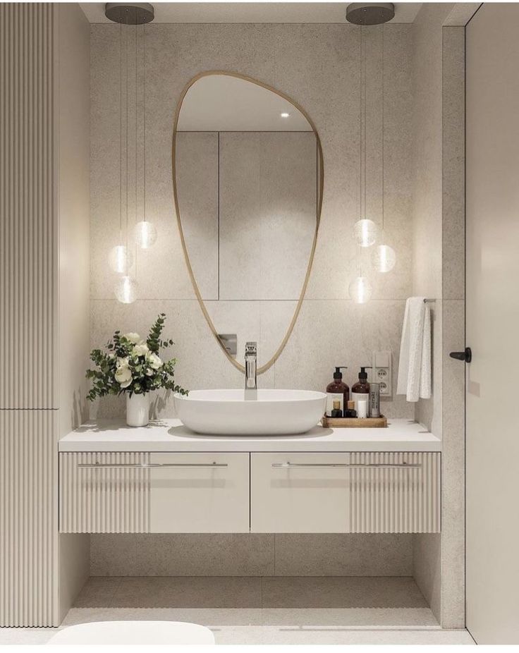 a bathroom with a sink and mirror in it