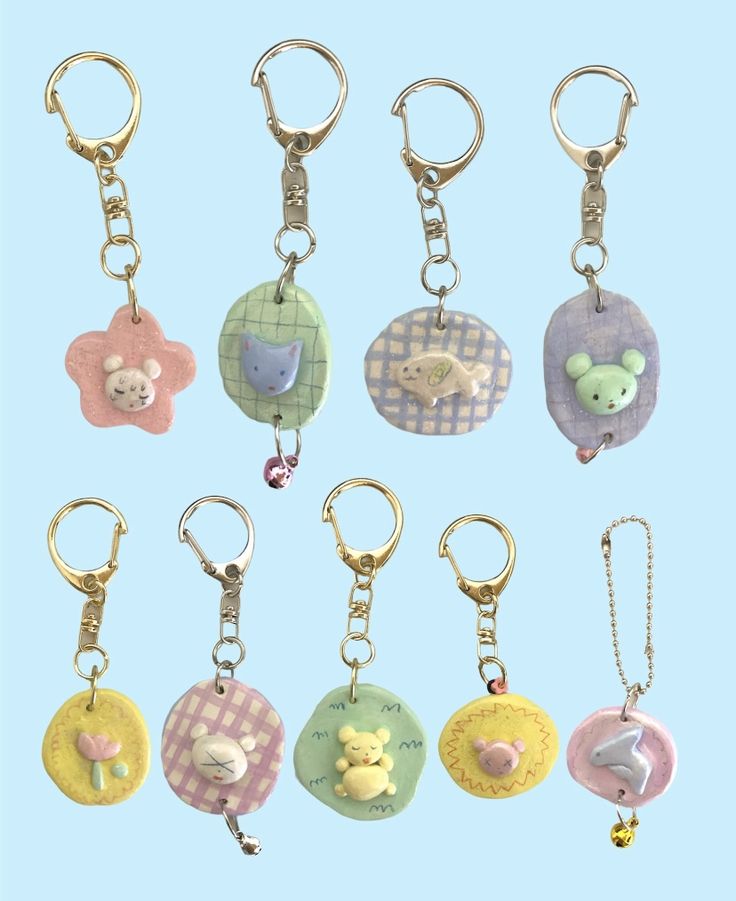 a bunch of different key chains with animals on them