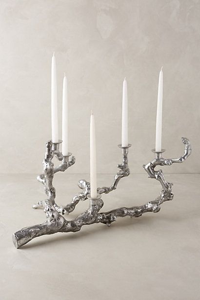 a silver candelabra with five candles in it