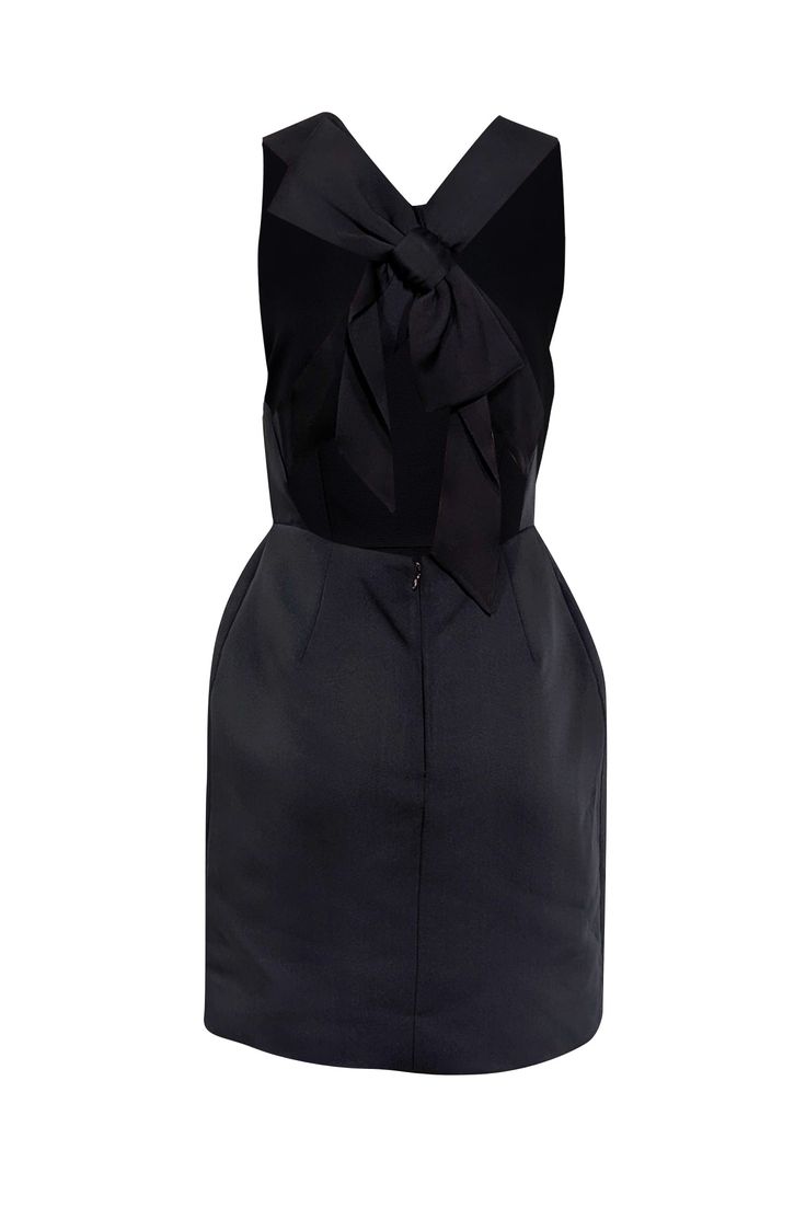 Unleash your inner fashionista with Kate Spade's black sleeveless bow-back cocktail dress. This chic little black dress is a must-have for any wardrobe. Perfectly styled with a strappy open-toe heel and a statement mini bag. It's time to turn heads and make a statement! Size 6 Shell 100% Polyester Lining 100% Polyester Bow 100% Viscose Invisible zipper back Bow back detail Bust 34" Waist 30" Shoulder to hem 35" Elegant Cocktail Mini Dress With Bow Tie Back, Sleeveless Evening Dress With Bow, Elegant Mini Dress With Bow For Black-tie Events, Dressy Evening Mini Dress With Bow, Dressy Bow Mini Dress For Evening, Elegant Sleeveless Dress With Bow, Formal Sleeveless Dress With Bow Straps, Chic Dresses With Bow Straps For Night Out, Chic Bow Mini Dress For Work