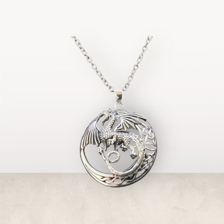 "Unique Large Handcast 925 Sterling Silver Celtic Dragon Warrior Pendant accented with Celtic Knotwork                                                        + Free 18\" long 316L non allergenic Surgical/Stainless Steel Cable Link Chain OR 18\" long 925 Sterling Silver Box Chain  Longer chains available for a surcharge Chain Choices: Hypoallergenic 316L Surgical Stainless Steel Cable Link Chain (Picture#1; Picture#2) 925 Sterling Silver Box Chain (Picture#3) 925 Sterling Silver Rope Chain (Pictu Nickel-free Silver Stainless Steel Necklace, Symbolic Necklace With Silver Chain And Round Pendant, Symbolic Silver Chain Necklace With Round Pendant, Symbolic Necklaces With Silver Chain And Round Pendant, Symbolic Necklaces With Round Silver Pendant, Silver Symbolic Charm Necklace With Round Pendant, Silver Charm Necklace With Oxidized Finish And Round Pendant, Silver Engraved Chain Necklace With Round Pendant, Silver Stainless Steel Necklace With Round Pendant