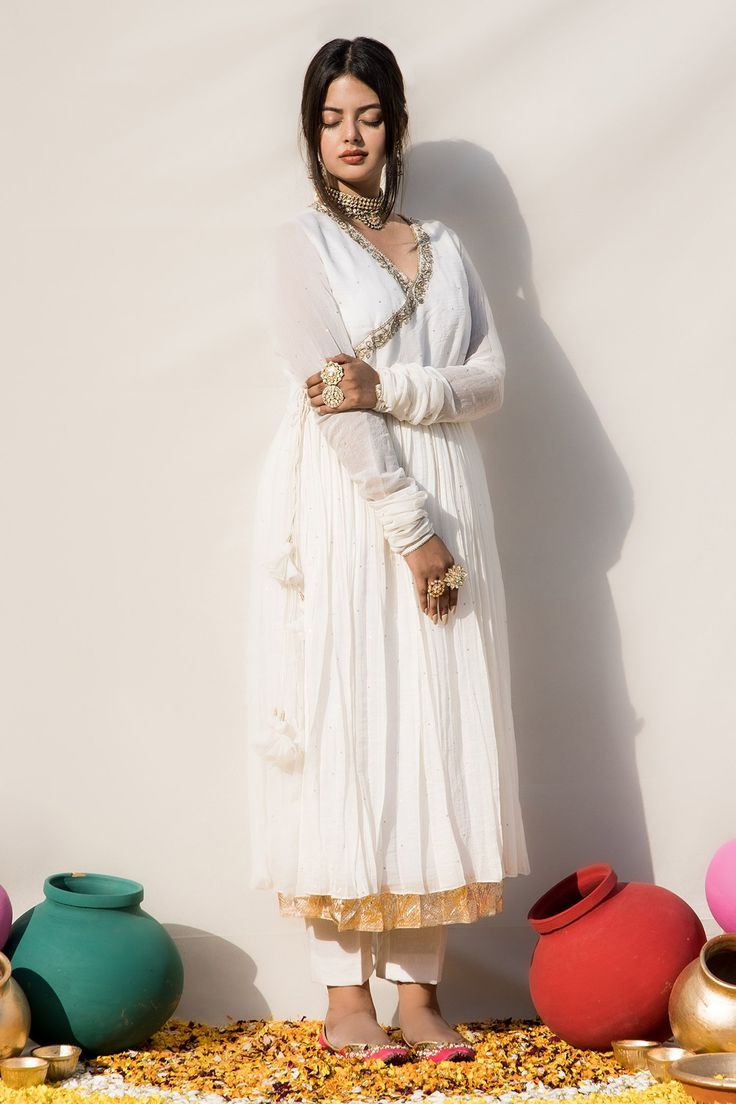 Ivory mul chanderi angrakha anarkali with pure lampi hand embroidered edges.
Components: 1
Pattern: Hand embroidered
Type Of Work: Pure lampi
Neckline: V Neck
Sleeve Type: Churidar Sleeves
Fabric: Mul chanderi, Lining : Mulmul
Color: Ivory
Other Details: 
Chinta work all over
Closure : Tie-up with tassels
Note : Pant and dupatta worn by the model are not for sale.
Disclaimer : The natural imperfection and textures in the weaves are the outcome of handloom fabrics (not to be considered as defect) Off White Floor-length Designer Anarkali Set, White Churidar With Sheer Dupatta In Chanderi, White Cotton Silk Churidar With Sheer Dupatta, White Chanderi Churidar With Sheer Dupatta, White Anarkali Churidar With Sheer Dupatta, Anarkali Cream Cotton Silk Salwar Kameez, Designer White Straight Kurta Churidar, White Salwar Kameez With Sheer Dupatta And Long Sleeves, White Cotton Silk Anarkali Set For Eid