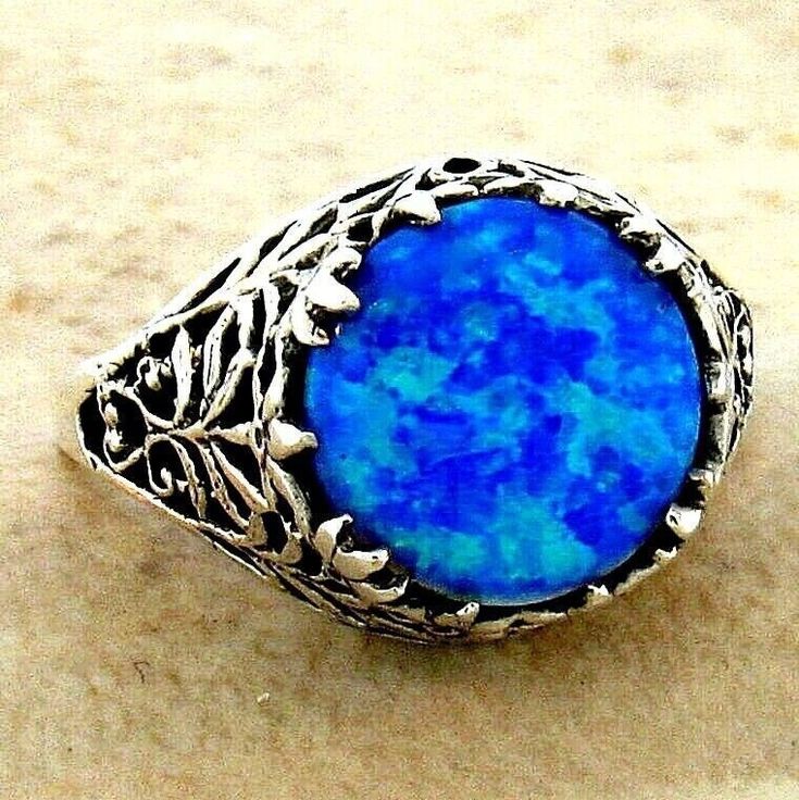 Vintage Estate Blue Lab-Created Fire Opal Solitaire Filigree Ring. 925 Solid Sterling Silver. Stamped 925.  Excellent Condition/Like New. Classic Blue Opal Round Ring, Blue Filigree Ring Hallmarked, Blue Hallmarked Filigree Ring, Blue Fire Opal, Blue Fire, Filigree Ring, Blue Band, Solitaire Ring, Fire Opal