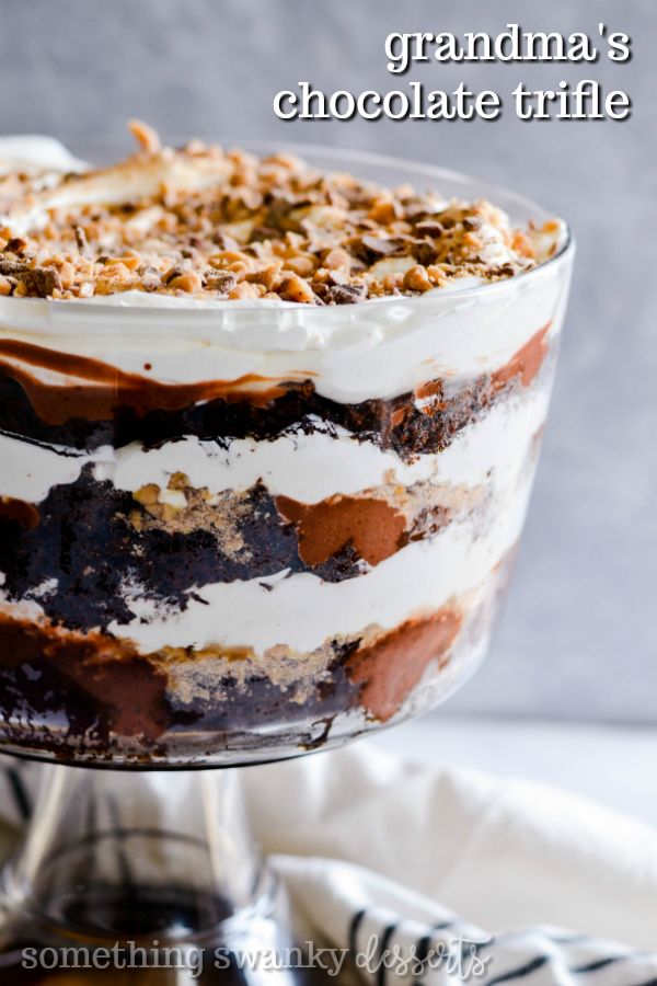 an image of a chocolate trifle dessert on a cake stand with the words grandma's chocolate trifle above it