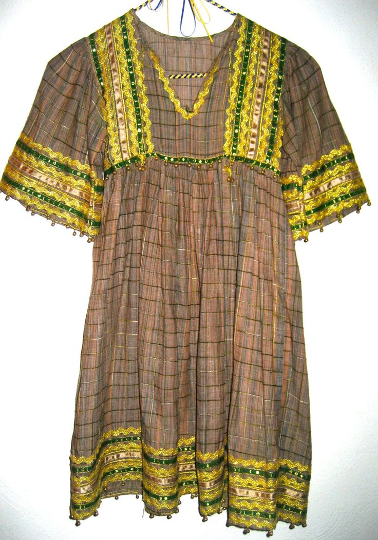 Amazing vintage dress in an ethnic hippie style, has trims and rick rack at neck, bodice, sleeves and hem. Dress is not marked and has no size label, please go by measurements for best results. Perfect for x small adult, condition is good with 2 small areas that can be repaired at top of shoulder. Fabric is a beautiful semi sheer soft cotton with a small raised stitch or weave. Any questions just convo. Thanks!! Across shoulders 11 inches Across bust 14 inches Across waist 14 inches Total length Boho 70s, Short Frock, Boho Hippie Dress, Rick Rack, Clothes Ideas, Womens Tunics, Hem Dress, Dress Design, Hippie Style