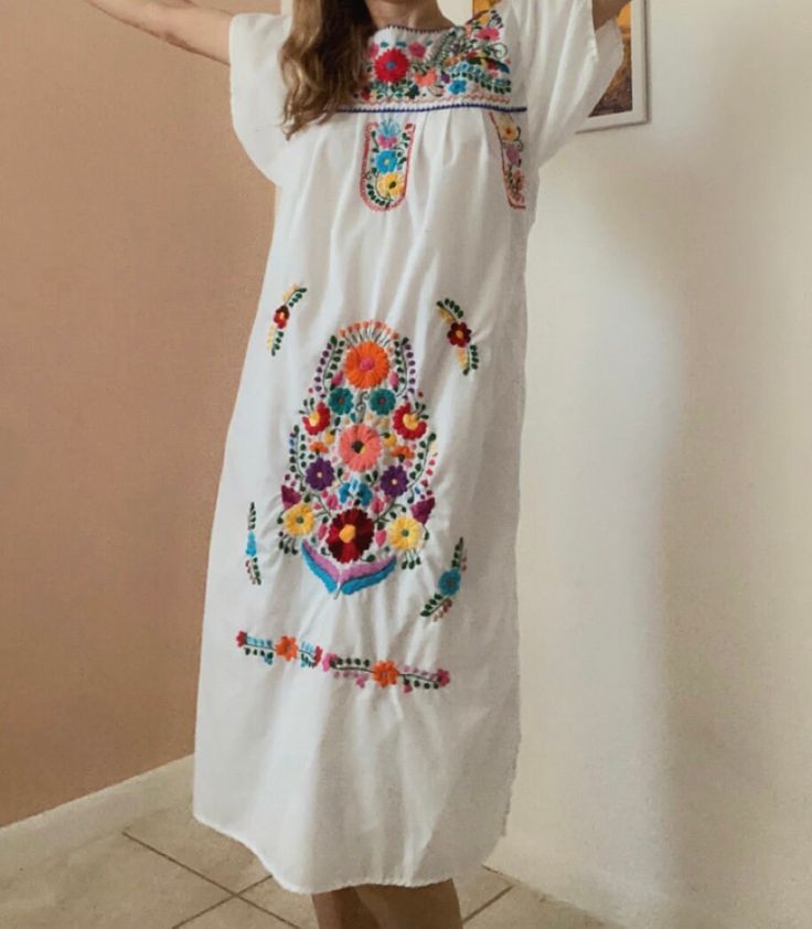 "Ideal for sunny afternoons in the park with friends or rocking it poolside on vacay! This beautiful hand embroidered number was discovered in the Catskills.  Shoulder: 17\" Bust: 34\" Waist: Free Size, Fits up to 38\" Length: 42\" Fabric: 💯 cotton" Folk Style Long Sleeve Embroidered Dress For Summer, Long Sleeve Folk Embroidered Dress For Summer, Folk Style Long Sleeve Embroidered Summer Dress, Summer Vacation Dresses With Geometric Embroidery, Long Sleeve Embroidered Summer Beach Dress, Summer Folk Style Embroidered Dress, Spring Beach Dress With Multicolor Embroidery, Casual Embroidered Dress For Beach, Casual Embroidered Dress With Geometric Patterns For Vacation