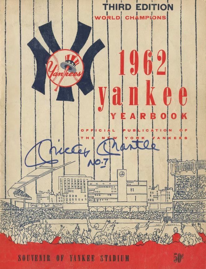 an old baseball program with the yankees logo on it