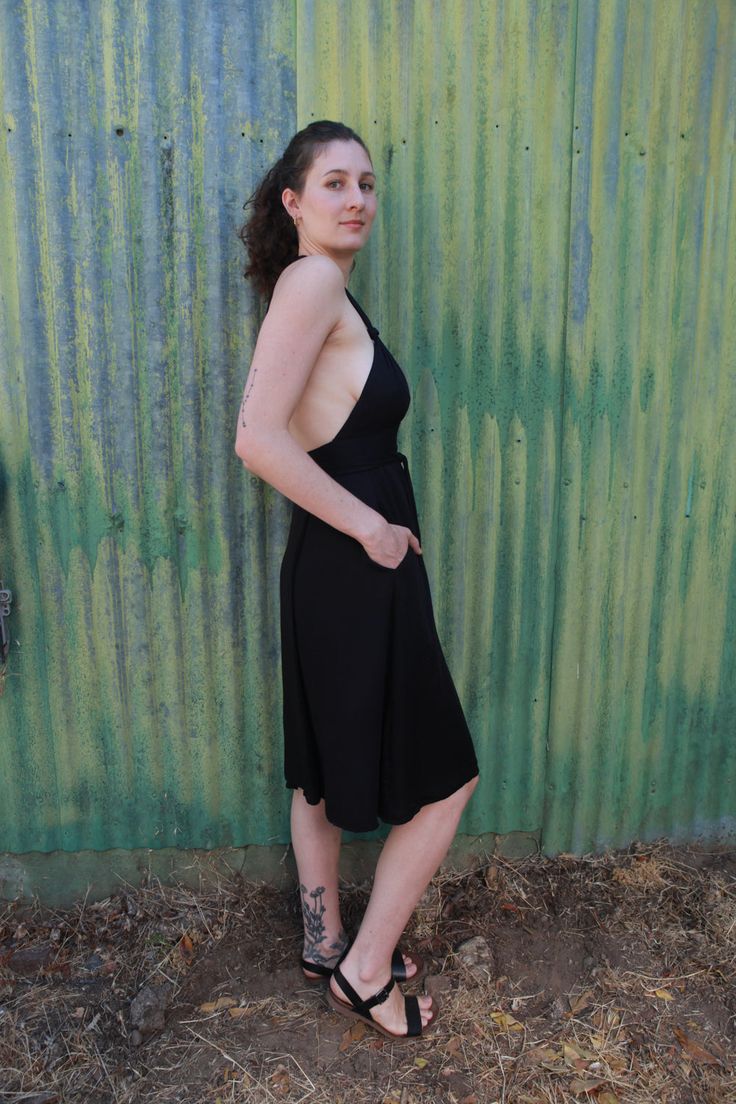 The Monroe dress is one of our most versatile fits for many different bodies as it is double adjustable. It wraps around the waist and also halter ties at the neck making it form to your body perfectly. You can make the straps more sexy by tying knots or twisting as shown in the photos. Big side seam pockets that don't add bulk. Double lined bust so you can wear it without a bra and not be too nippily. Open back that is super sexy. Can we warn with a long sleeve underneath on chillier days. Made Backless Midi Dress With Built-in Bra For Date Night, Summer Halter Neck Dress With Built-in Bra, Summer Backless Dress With Built-in Bra And Low Back, Sundress With Built-in Bra For Night Out, Fitted Midi Sundress With Straps, Fitted V-neck Suspender Sundress, Fitted Sundress With Built-in Bra, Halter Dress With Low Back For Date Night, Fitted Halter Dress With Low Back And Back Opening