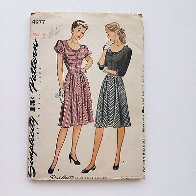 an old fashion sewing pattern from the 1950's, featuring two women in dresses