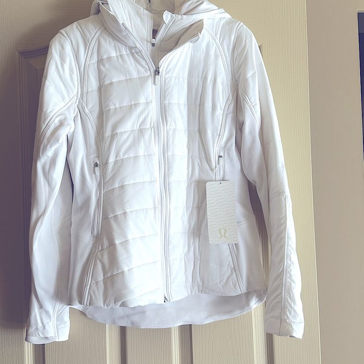 Nwt Lululemon Extra Mile Jacket, Size 8. Please See Photo Of Hang Tag For Full Item Description. Smoke Free, Pet Friendly Home. Reasonable Offers Considered. No Bundles Or Trades. White Winter Activewear For Outdoor Activities, White Long Sleeve Outerwear For Workout, White Spring Workout Outerwear, White Outerwear For Spring Workout, White Functional Winter Activewear, Extra Mile, Pet Friendly, Lululemon Athletica, Color White