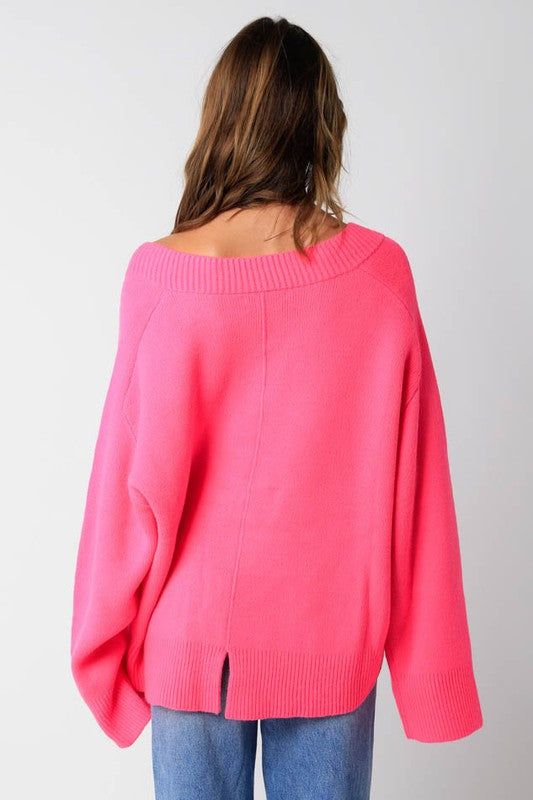 STYLE INFORMATION: The Leila Pink V-Neck Oversized Sweater is the sweater of the season! Pink knit fabric shapes an oversized sweater with a V-neckline and long, relaxed sleeves. Features ribbed knit neckline, cuffs, and hemline. DETAILS & CARE: Acrylic. Hand wash cold. Imported. SHIPPING: We offer free shipping for all orders in the Continental US. Oversized V-neck Cardigan With Ribbed Cuffs, Oversized V-neck Sweater For Layering, Oversized V-neck Sweater With Ribbed Cuffs, Oversized Cozy V-neck Sweater With Ribbed Cuffs, Oversized V-neck Chic Sweater, Oversized V-neck Cropped Sweater For Spring, Oversized V-neck Sweater For Fall, Oversized Knit V-neck Sweater With Long Sleeves, Fall Cropped Sweater With Ribbed Neckline For Loungewear