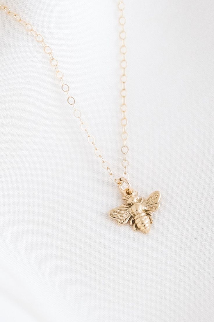 This little gold pendant necklace is dainty and sweet! Our Honey Bee Necklace features a teeny little bee, suspended on a gorgeous cable chain. We love it paired with our Queen Bee Necklace. Gold filled or sterling silver - it's perfect for everyday wear without tarnishing. AND it's affordable. Find more at Simple & Dainty! Handmade Cute Charm Necklaces, Cute Handmade Everyday Charm Necklaces, Cute Everyday Handmade Charm Necklaces, Cute Everyday Necklace With Adjustable Chain, Cute Everyday Necklaces With Charms, Cute Everyday Pendant Charm Necklaces, Cute Necklace With Adjustable Chain For Gift, Cute Necklace With Adjustable Chain As Gift, Handmade Delicate Charm Necklace For Everyday