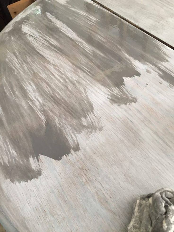 an old table with some paint on it