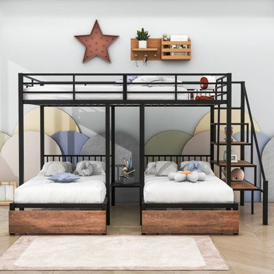 two bunk beds in a room with white walls and wood flooring, along with a rug on the floor