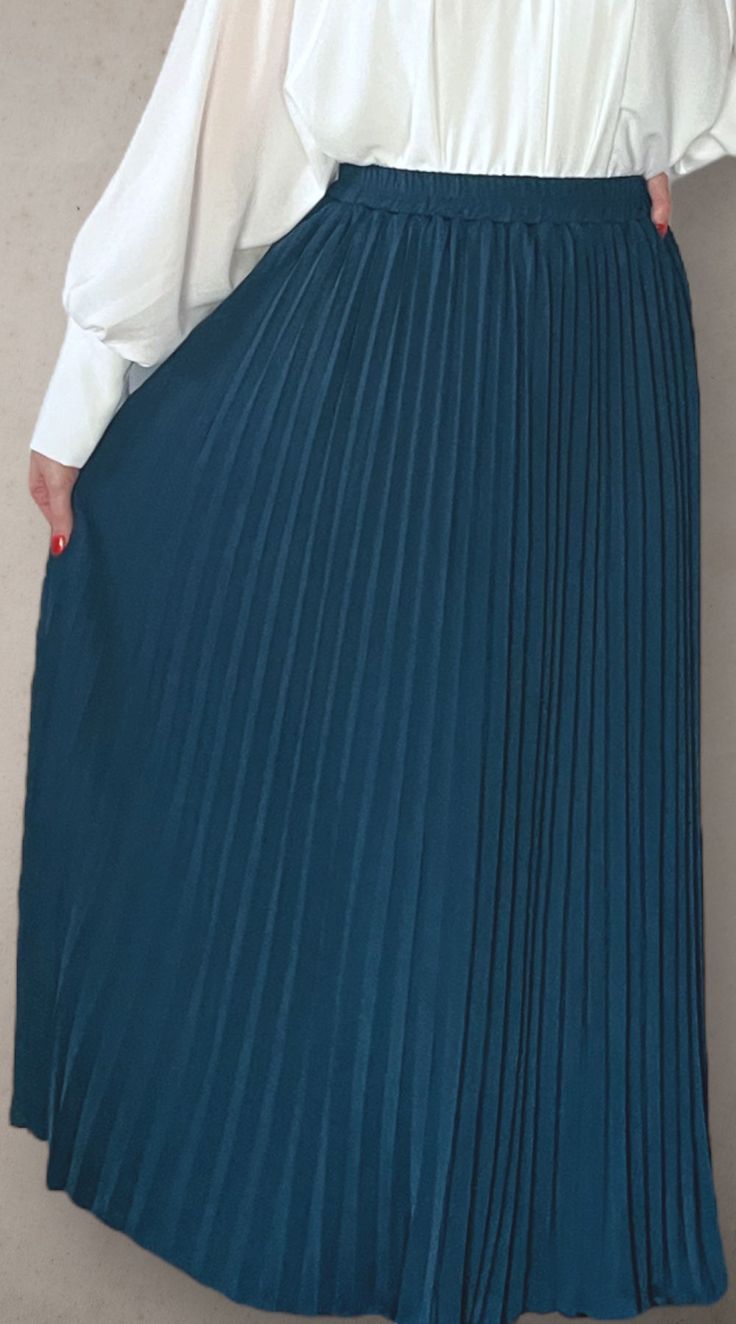 Modest high rise maxi skirt. Elastic waistband. Pleated. Fully lined for full coverage. High Waist Solid Color Maxi Skirt, Elegant Non-stretch Pleated Maxi Skirt, Elegant Non-stretch Long Pleated Skirt, Elegant Non-stretch High Waist Maxi Skirt, Elegant Long Non-stretch Pleated Skirt, Solid Color Maxi Skirt With Elastic Waistband, High-waisted Pleated Work Skirt, Chic Pleated Maxi Length Skirt, Elegant Solid Maxi Skirt With Elastic Waistband