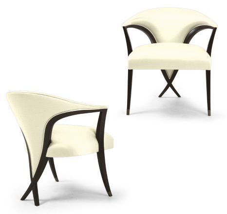 two white chairs sitting next to each other