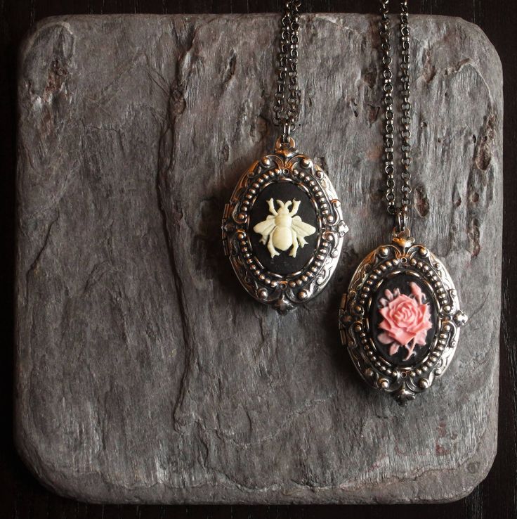 Detailed cameos set in layered, detailed antiqued silver on an antiqued silver locket.  Choose from a black and cream bee cameo or a pink rose cameo with a black background.  Locket opens with two spaces for pictures. Details: Locket measures 1.25 inch x 7/8 inch Lockets and chain are antiqued silver plated Chain measures 24 inches Cameos are hard, matte resin Please allow for possible slight color differences due to different settings on different screens. Thank you for shopping Delicate Indust Rose Locket, Hammered Silver Jewelry, Silver Locket Necklace, Gift Ideas For Mom, Jewelry Holiday, Silver Locket, Cameo Jewelry, Holiday Gift Ideas, Bee Gifts