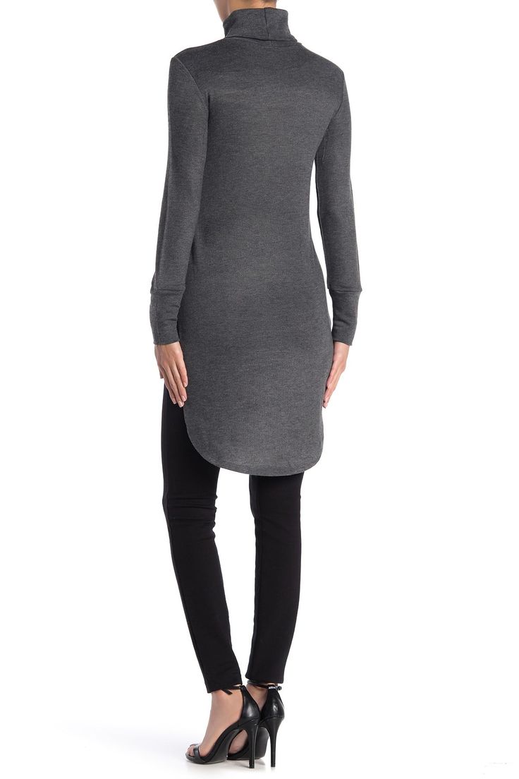 A classic turtleneck offers a refined, elegant style into a tunic sweater with a dramatic high/low hemline. Turtleneck. Long sleeves. Knit construction. High/low hem. Approx. 30" shortest length, 38.5" longest length (size S). ImportedAvailable in:. Solid colorway (Black). Geometric print (Charcoal Colorful Geo). American flag print (Heather Grey USA Verticals). Elephant print (Charcoal Elephant Up). Lion print (Charcoal Lion Mane). Colorblock print (Ivory Blocks & Peacock Print)This item ca Back To School Outfits Black, Tunic Dress With Leggings, Back To School Outfits For Teens, Classic Turtleneck, High Low Tunic, Peacock Print, Back To School Outfits, Tunic Length, Tunic Sweater