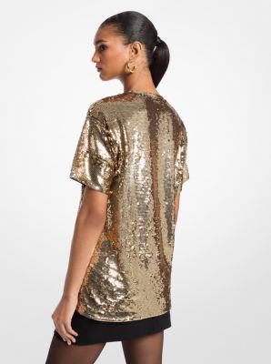 Turn up the shine on your favorite T-shirt. Allover sequins put a luxe spin on this oversized, borrowed-from-the-boys fit. It instantly elevates your favorite jeans. Party Season Sequined Crew Neck T-shirt, Fall Contrast Sequin Crew Neck Top, Fall Crew Neck Top With Contrast Sequin, Glamorous Shiny Top For Fall, Spring Sequins T-shirt For Night Out, Sequin T-shirt For Night Out In Spring, Spring Sequin T-shirt For Night Out, Spring Night Out Sequined T-shirt, Gold Short Sleeve Top With Glitter Print