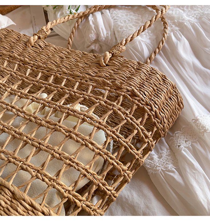 An artisanal basket of hand-woven straw basket bag. Perfect for this summer! Shoulder or top handle carry. Its light weight and durable construction make it ideal for carrying items for a day at the beach or a special event. Show off your style and make a statement with this unique tote bag. Size: 37cm wide opening x 25cm tall (14in x 10in) Designer Style ID: 8439 Braided Rattan Crochet Rectangular Bag, Braided Rattan Crochet Bag Rectangular, Rectangular Straw Bag With Bamboo Handle For Vacation, Rectangular Rattan Straw Bag For Vacation, Vacation Rectangular Straw Bag With Bamboo Handle, Vacation Crochet Rattan Bag, Casual Beach Bag With Bamboo Handle For Vacation, Spring Eco-friendly Braided Straw Bag, Vacation Woven Rattan Crochet Bag