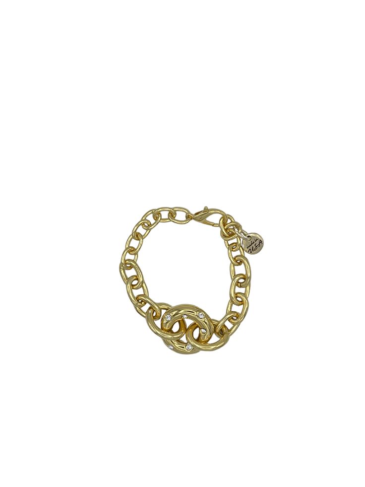 Details: Chunky Statement Bracelet Large Donut Shaped Connector Ring with Crystal Accents Lobster Claw Clasp Handmade Approximate Length: 6.5 7.7 Connector Ring: 1.1" x 1.1" Chic Chain Link Bracelet With Lobster Clasp, Formal Gold-tone Metal Chain Bracelet, Chic Gold-tone Link Chain Bracelet, Gold-tone Bangle Chain Bracelet For Party, Gold-tone Metal Chain Link Bracelet, Gold-tone Metal Chain Bracelet With Lobster Clasp, Adjustable Chain Link Gold-tone Bracelet, Trendy Gold-tone Oval Link Chain Bracelet, Chic Metal Chain Bracelets