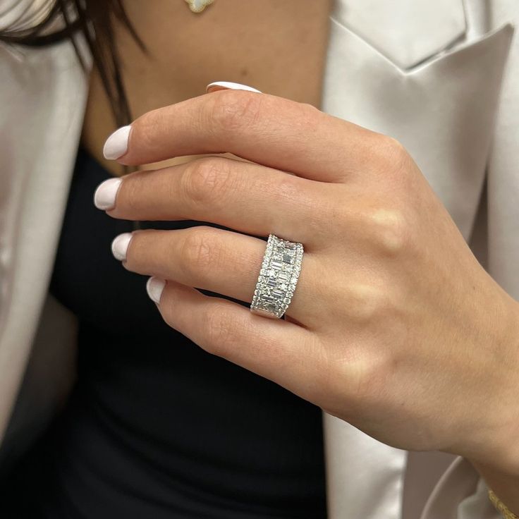 Modern Ladies Thick Band Ring Crafted In 18k White Gold. This Ring Features Baguette Cut And Round Cut Sparkling Diamonds Encrusted In Prong Setting. Total Diamond Weight: 2.11 Carats. Diamond Quality: Color G-H And Clarity Vs-Si. Ring Size: 6.75. Ring Width: 9.8mm. Total Weight: 8.21 Grams. Comes In A Presentable Gift Box. Id: 01356 Dazzling White Gold Diamond Ring With Baguette Diamonds, Luxury Platinum Jewelry With Baguette Diamonds, Luxury White Diamond Ring With Baguette Diamonds, Luxury White Baguette Diamond Ring, Fine Jewelry Diamond White Ring With Baguette Diamonds, Formal White Diamond Ring With Baguette Diamonds, Luxury Silver Diamond Ring With Baguette Diamonds, Luxury Diamond Ring With Baguette Diamonds, Platinum Rings With Baguette Diamonds In White