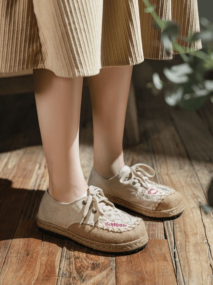 The perfect blend of style and comfort. These shoes are designed to elevate your casual looks with their unique and eye-catching design. Crafted with premium quality linen, our Embroidered Linen Sneakers are designed to be soft, breathable and comfortable. The intricate floral embroidery on the upper adds a touch of elegance and sophistication to the classic design, making them a stylish addition to any wardrobe. 0.98" heel Lace-up closure Canvas linen upper Textile lining Natural straw mat brea Casual Flat Lace-up Shoes With Textured Sole, Spring Streetwear Lace-up Canvas Shoes, Casual Breathable Slip-on Canvas Shoes, Trendy Breathable Lace-up Canvas Shoes, Trendy Breathable Canvas Shoes With Round Toe, Spring High-top Breathable Canvas Shoes, Trendy Round Toe Sneakers For Leisure, Breathable Leisure Sneakers With Round Toe, Trendy Beige Slip-on Canvas Shoes