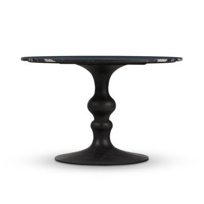 a black table with an oval top on a white background