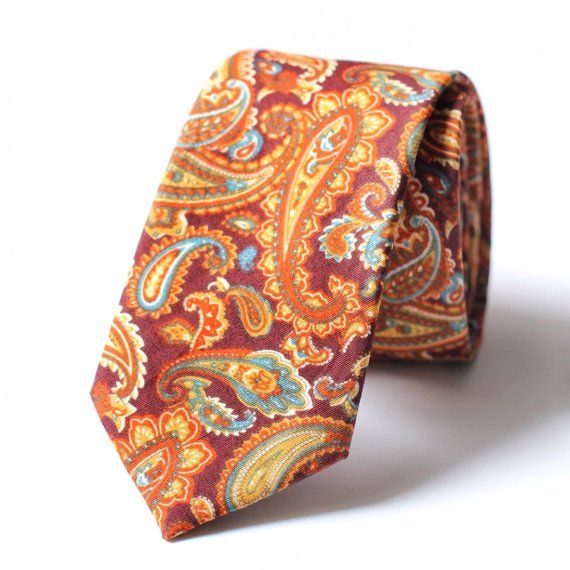 • 2.5" at the widest point• Approximately 58" in Length• Handmade• 100% Cotton• Dry Clean onlyVintage style floral print. This tie is suitable for weddings, proms, casual throw downs, dinner and all special occasions. This tie will certainly start the conversation with lots of compliments. Please note that due to differences in computer monitors, colors may vary slightly from those shown Wedding Paisley Print Tie, Fitted Paisley Print Suit And Tie Accessories For Wedding, Wedding Paisley Print Standard Tie, Wedding Ties With Paisley Print, Multicolor Fitted Suit And Tie Accessories For Wedding, Untied Bow Tie, Men Street Style, Wedding Tie, Brown Paisley