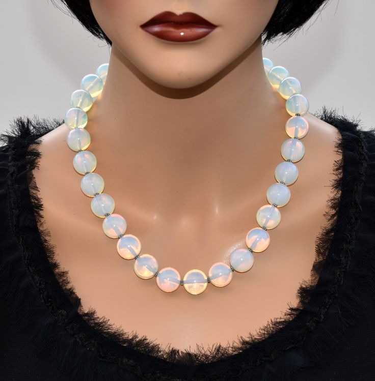 ♥ Ready to ship ♥ 100% handmade ♥ Packed in gift box ♥ Custom length Opalite Rainbow moonstone statement necklace designed with beautiful 14 or 16mm beads white with blue flashes. Luxury bold, elegant, and stylish necklace. Make a magnificent entrance on any occasion with this Exquisite Jewelry. Add a pair of matching earrings for extra impact. This is the perfect necklace for many occasions and would be a fantastic present! All my items are beautifully presented in a gift box. All my accessorie Handmade Iridescent Round Jewelry, Iridescent Beaded Round Bead Jewelry, Iridescent Beaded Jewelry As A Gift, Iridescent Beaded Jewelry For Gift, Iridescent Jewelry With Polished Round Beads, Iridescent Round Beaded Jewelry, Iridescent Polished Round Beads Jewelry, Handmade Iridescent Jewelry With Round Beads, Handmade Iridescent Round Bead Jewelry