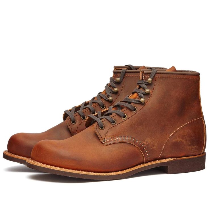 Take on harsh weather while maintaining classic style with the Red Wing 2955 Heritage Work 6' Blacksmith Boot. Constructed from weather-tough copper rough and tough leathers and featuring a snow-busting 6' height, these boots are built to last through stormy adventures. With a sturdy Goodyear welt for extended wear and Vibram sole for traction, your every step stays steady and secure. These boots bring tough good looks to any ensemble while keeping feet protected during demanding days outdoors. Waxed Finish Round Toe Boots For Outdoor Work, Outdoor Work Boots With Waxed Finish And Round Toe, Steel Toe Oiled Leather Work Boots With Snip Toe, Oiled Leather Work Boots With Reinforced Snip Toe, Steel Toe Snip Toe Oiled Leather Work Boots, Classic Steel Toe Boots In Oiled Leather, Brown Waxed Finish Boots For Outdoor Work, Classic Oiled Leather Boots With Steel Toe, Rugged Waterproof Boots With Waxed Finish