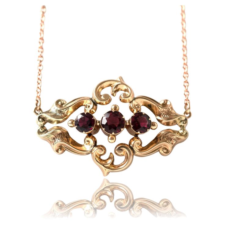 Garnet gemstones are the birthstone of January. The beautiful stones have been extremely popular since the 18th and 19th century, the gemstones are the ideal gem for that extravagant effect. Victorian garnets were faceted and clustered together for maximum effect, they are very romantic. Antique Victorian pendant featuring Garnets set in a warm ornate 9ct yellow gold setting. The pendant hangs on a new 9ct gold chain. The piece was converted from a brooch into a pendant by our expert Master Gold Luxury Victorian Antique Gold Necklace, Victorian Jewelry Necklace, 1800s Jewelry, Ornate Necklace, Antique Jewelry Victorian, Vintage Chain Necklace, Victorian Pendants, Garnet And Gold, Beautiful Stones