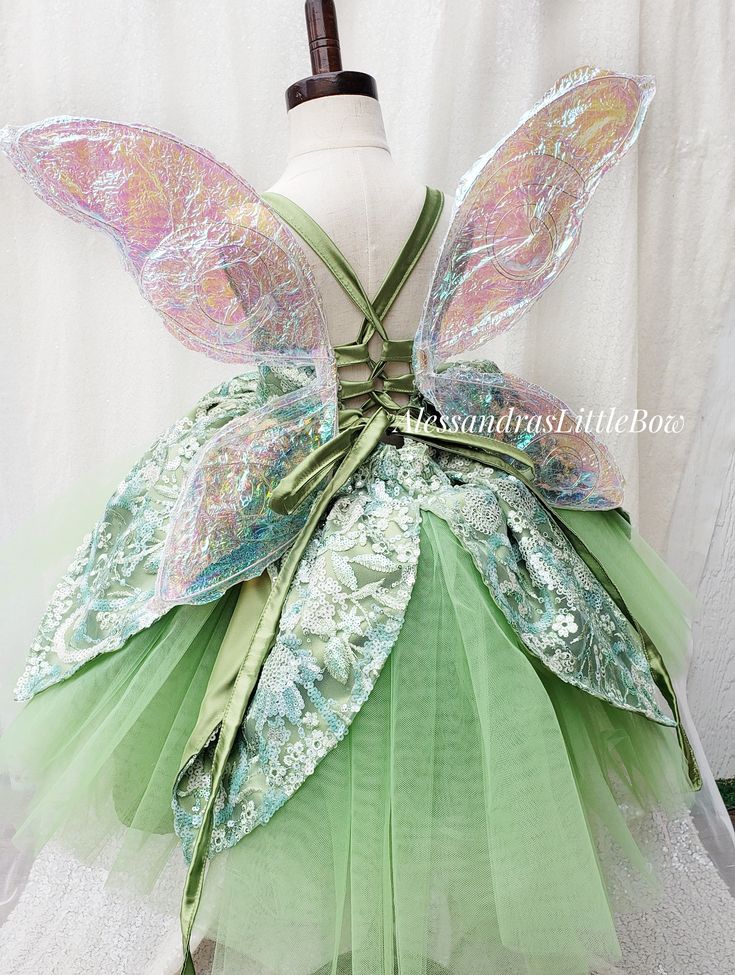 a dress made to look like a fairy's wings and green tulle skirt